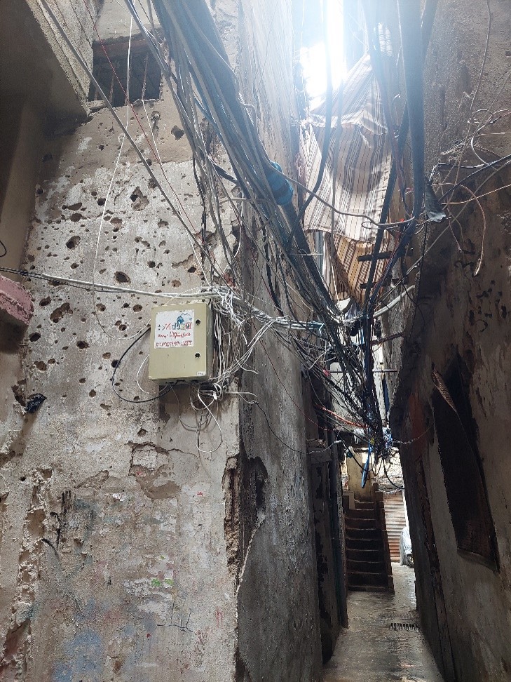 Remnants of wars: a bullet-riddled facade in an alley in Shatila camp. © Dalia Ghanem