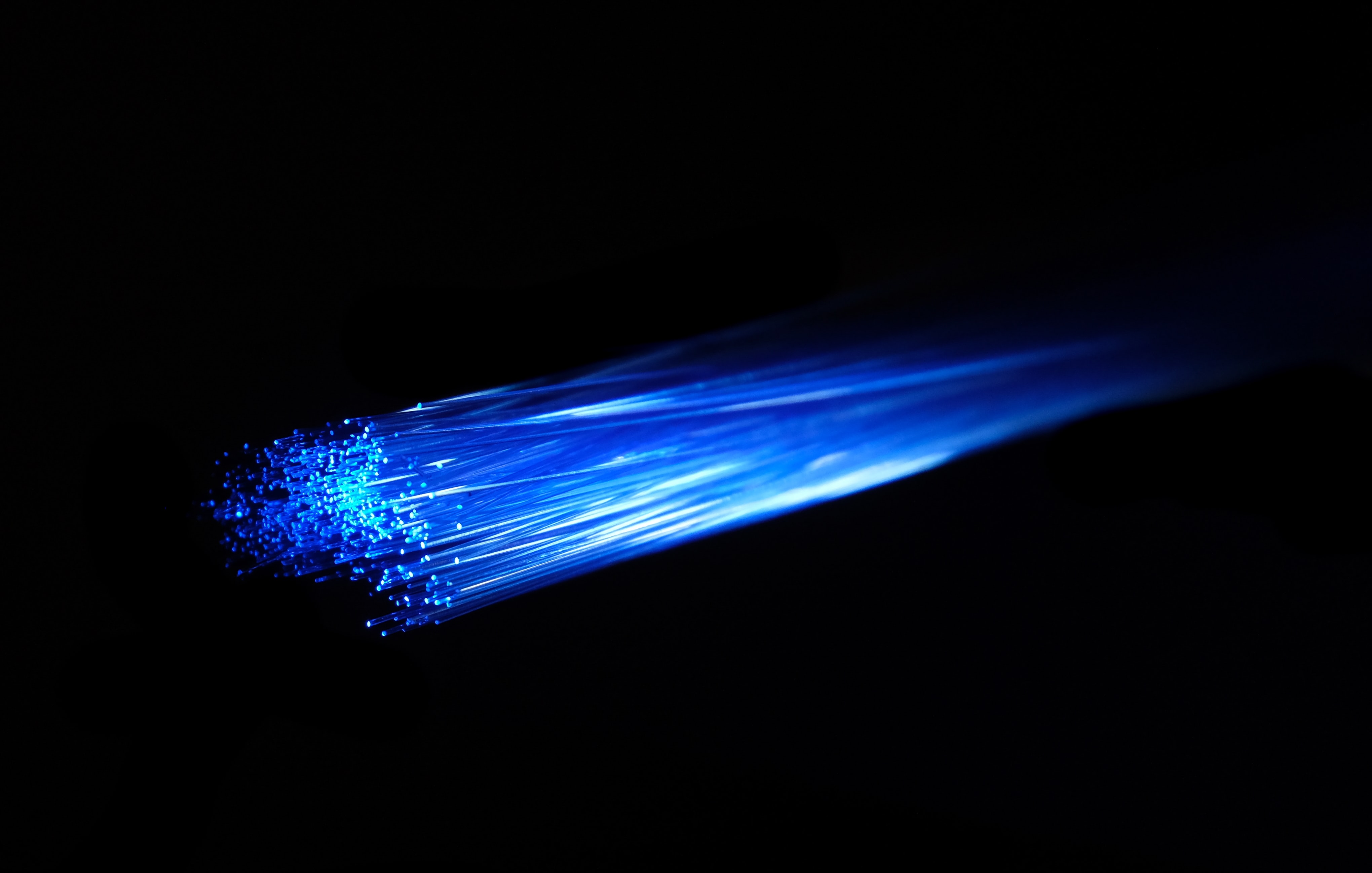 Blue light passing over fibre optic cable.