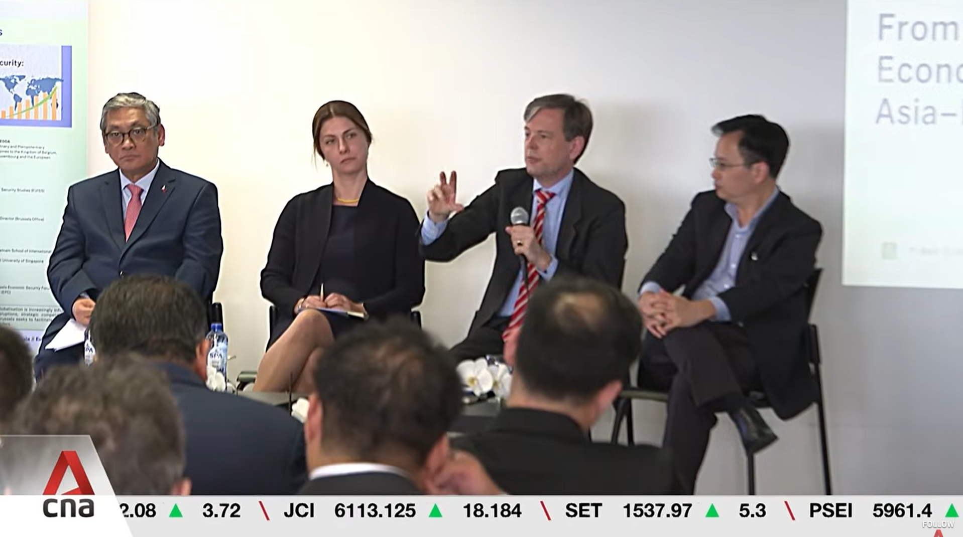 Screenshot from CNA news segment showing the panel of speakers.