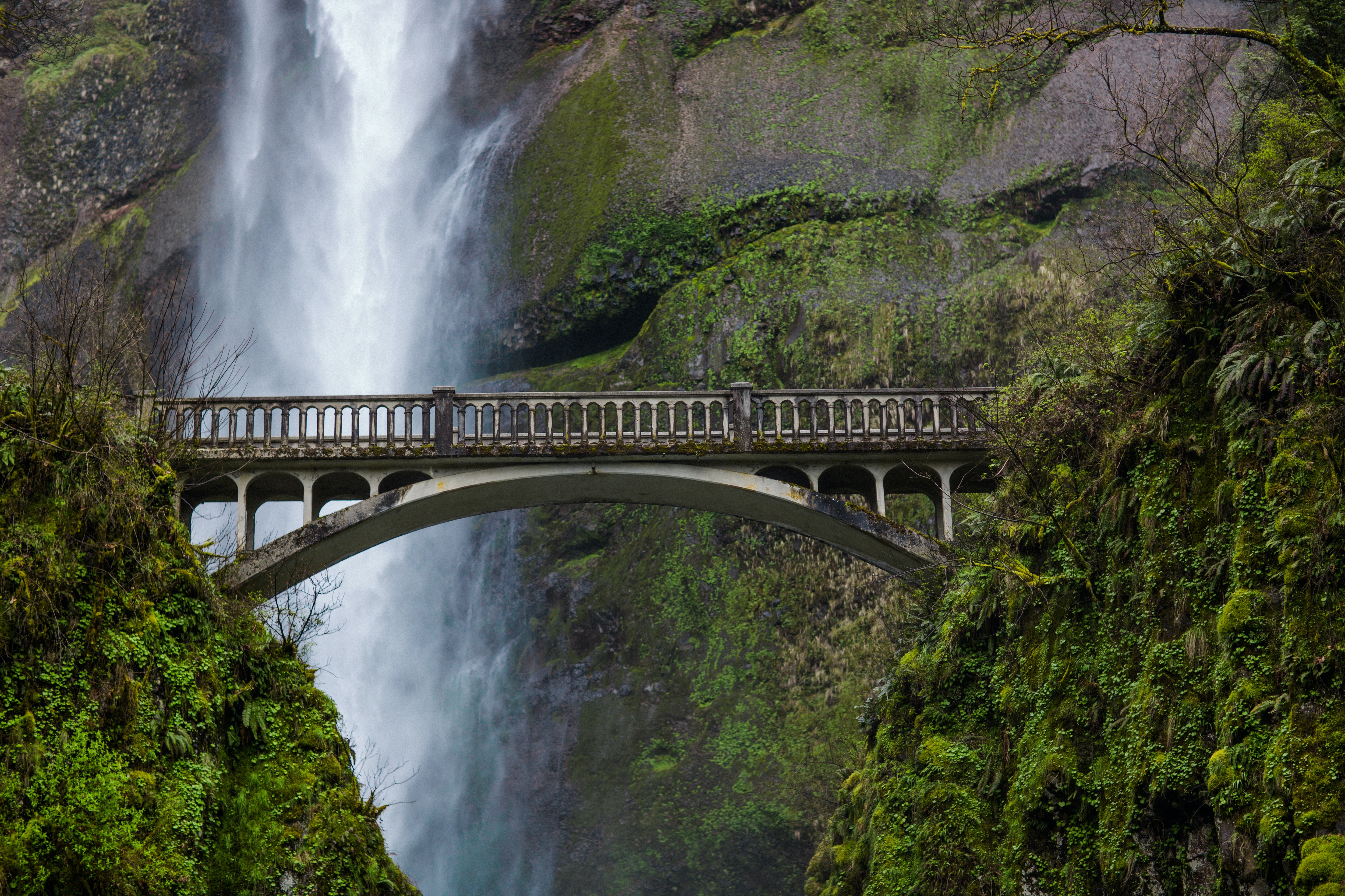 Bridge by waterfalls. Photo by James Forbes on Unsplash