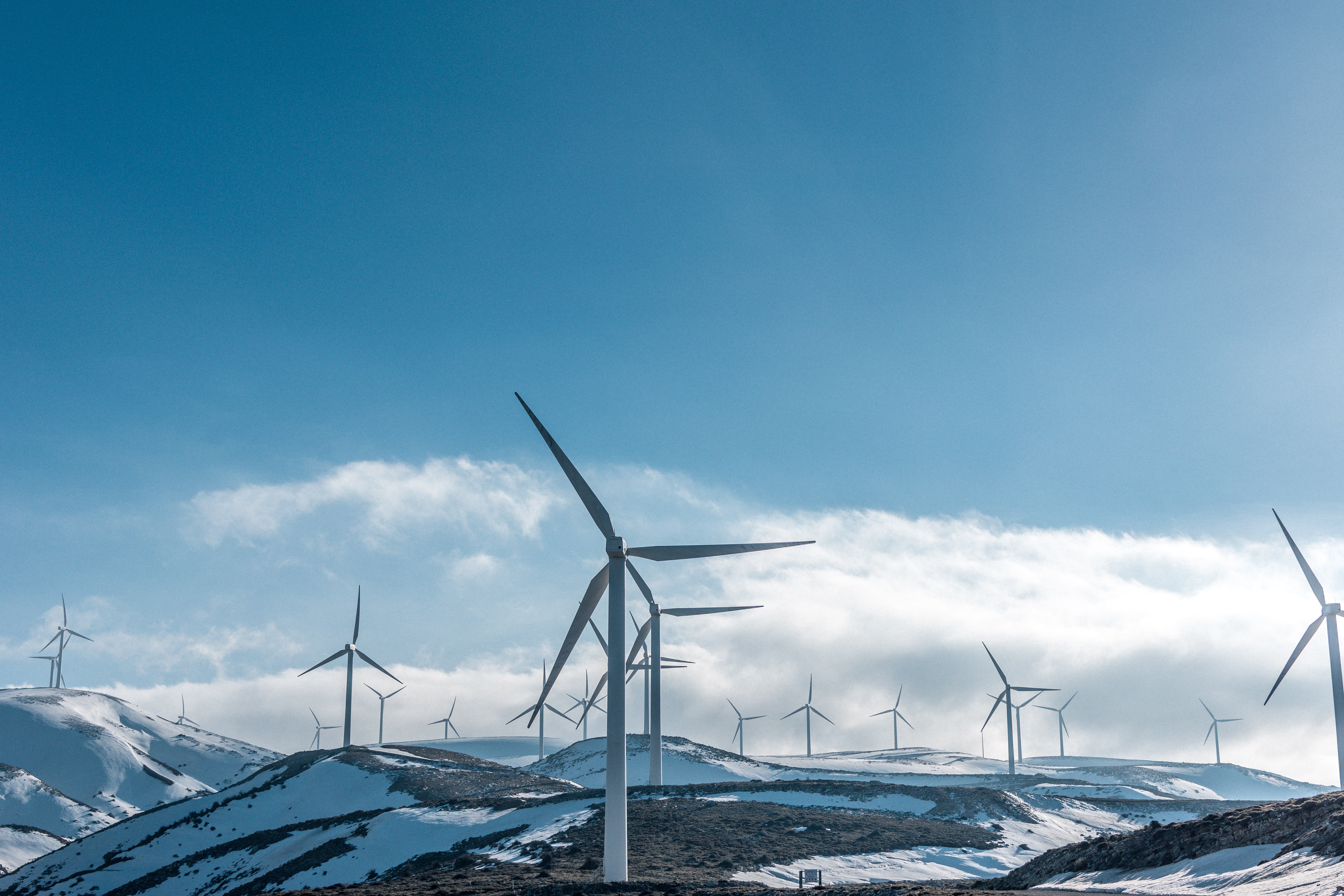 Wind turbines on snowy mountains