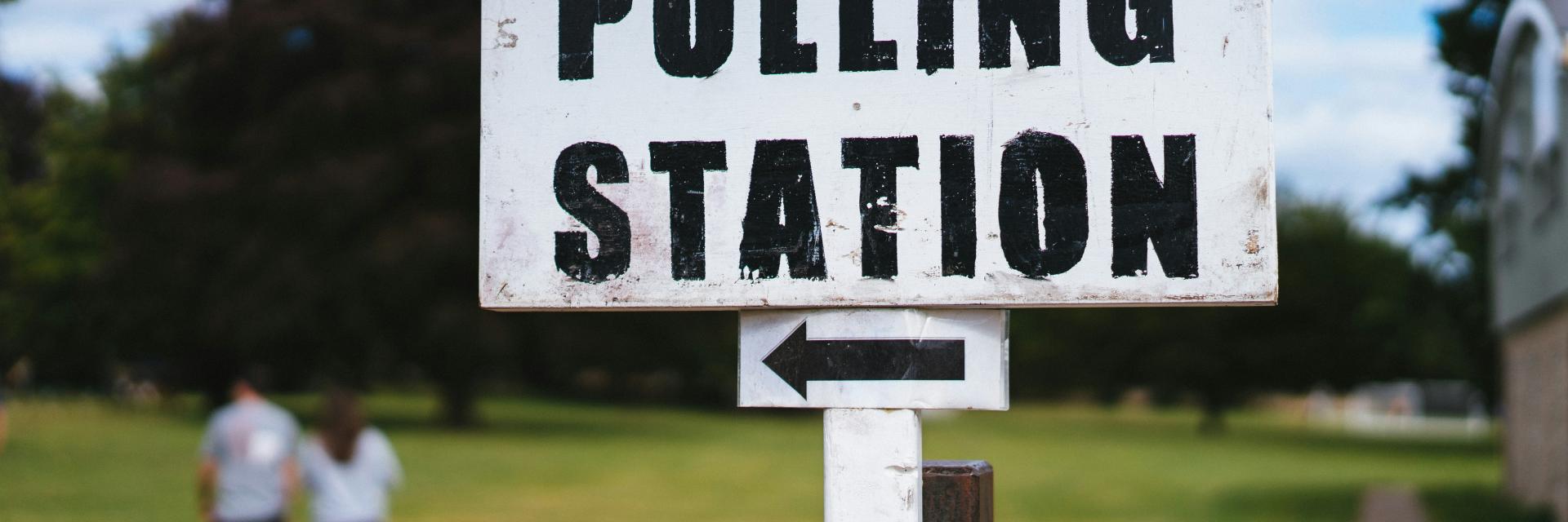 A polling station sign/Unsplash