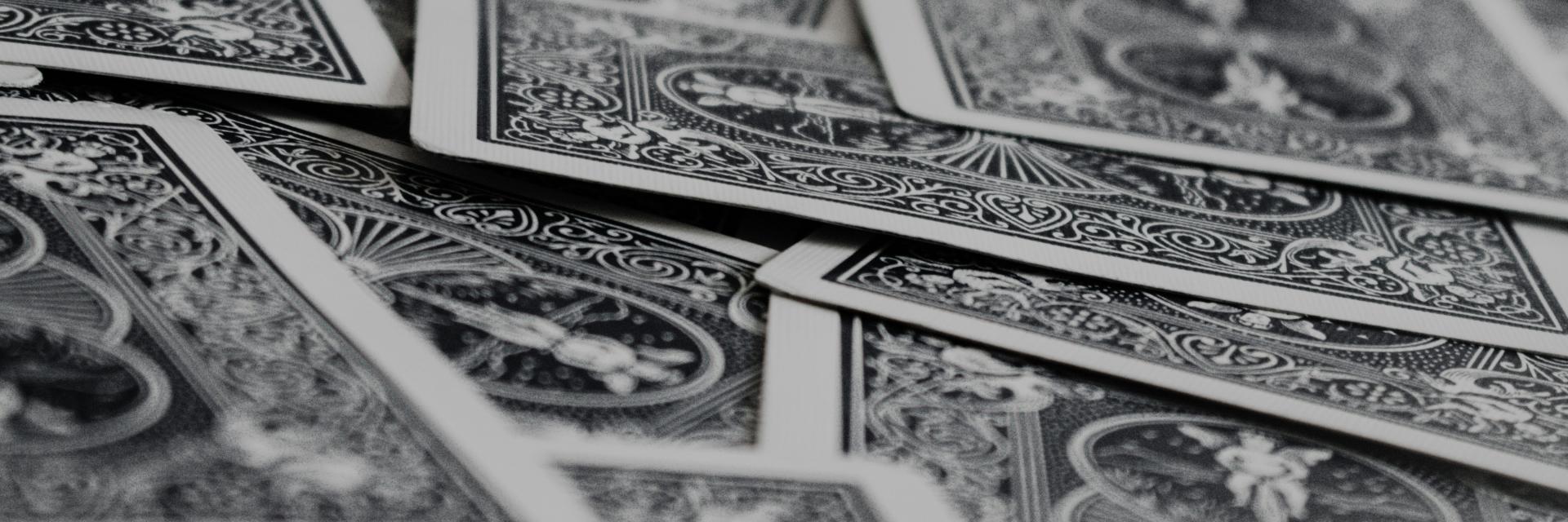 photo of playing cards, credit: Klim Musalimov/Unsplash