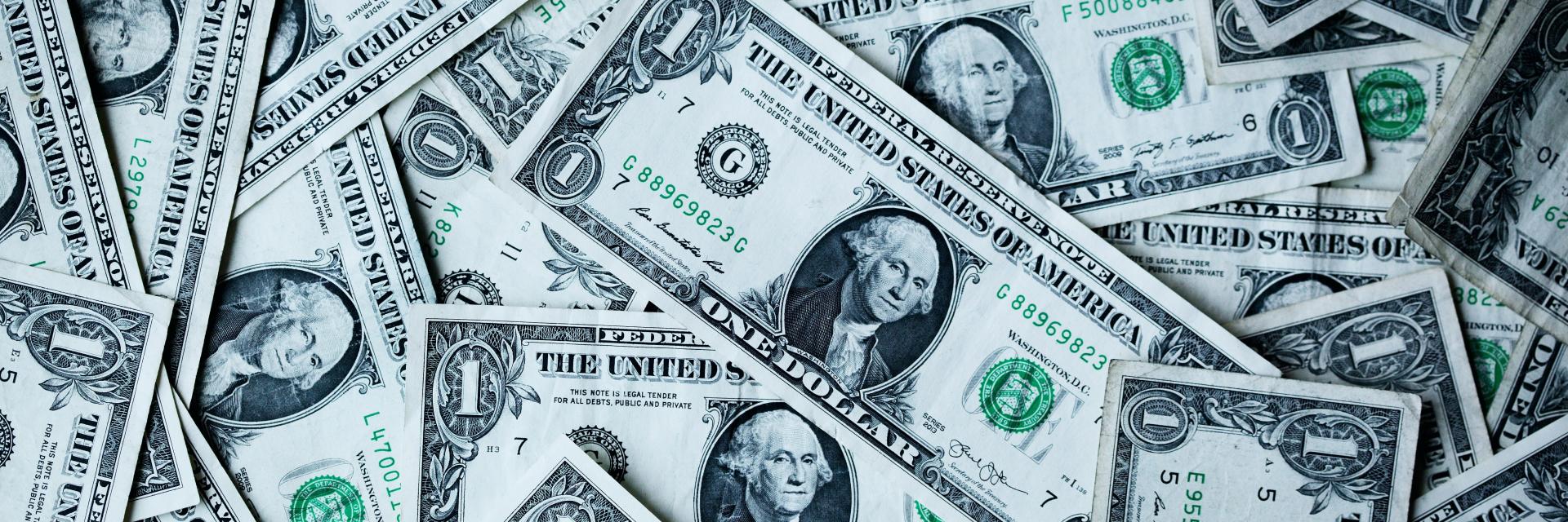 Dollar bills. Credit: Photo by Photo by Alexander Grey on Unsplash
