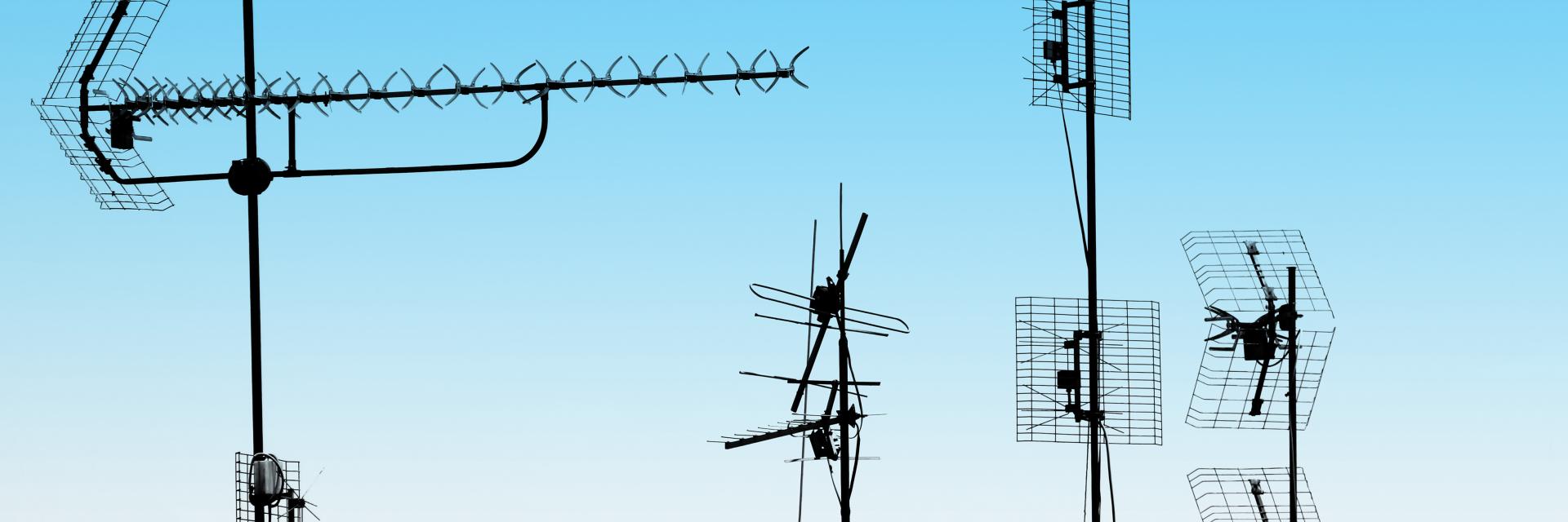 Antennas and pipes on a roof - Credit image: Envato elements