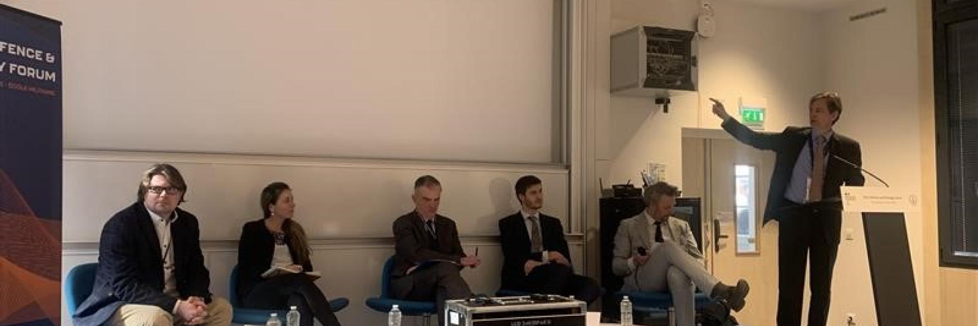 Participants to panel sitting on stage