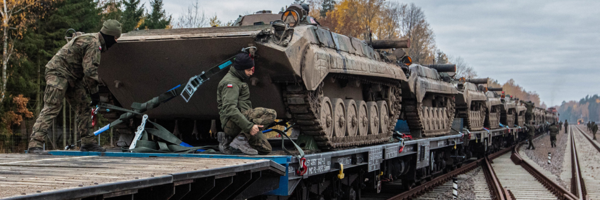 Soldiers on tanks. Credit: NATO/Flickr 