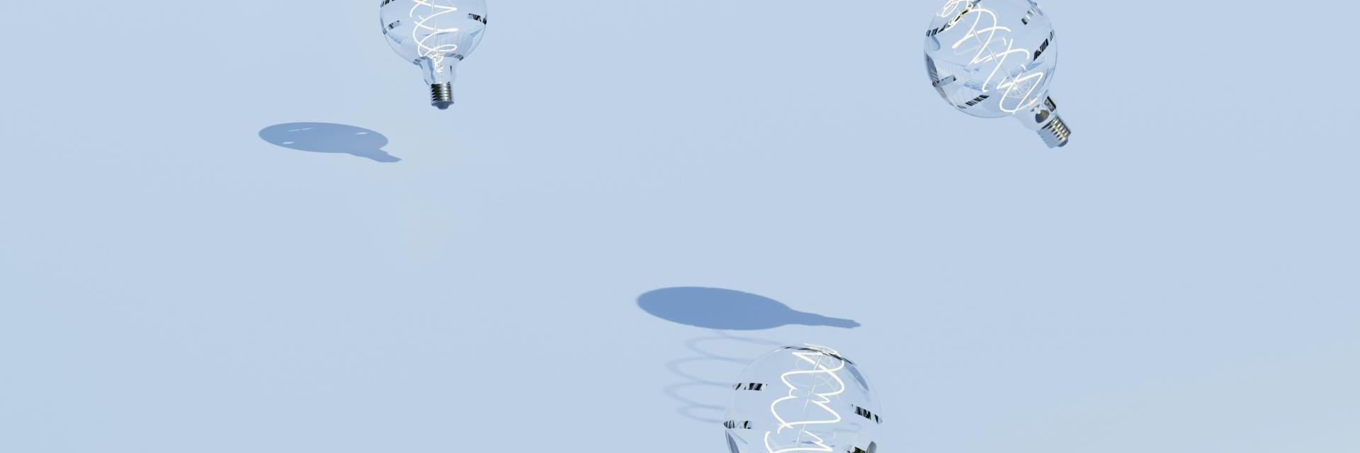 Light bulbs sitting on top of a snow covered ground. Photo by Anastasiia Ornarin on Unsplash: