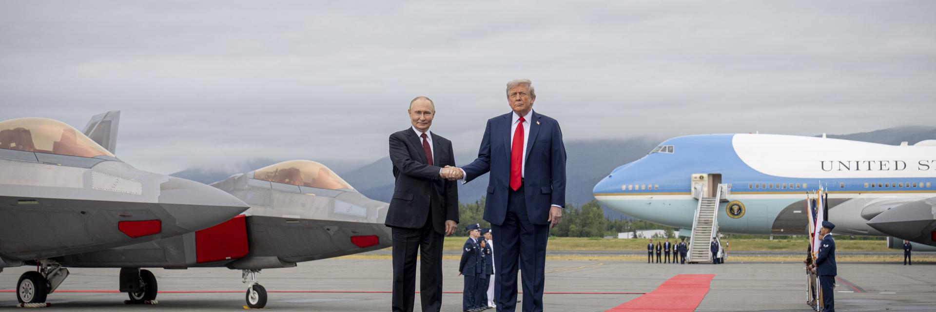 Donal Trump and Vladimir Putin shaking hands on tarmac in Alaska. Credit photo: DoD photo by Benjamin Applebaum, CC0
