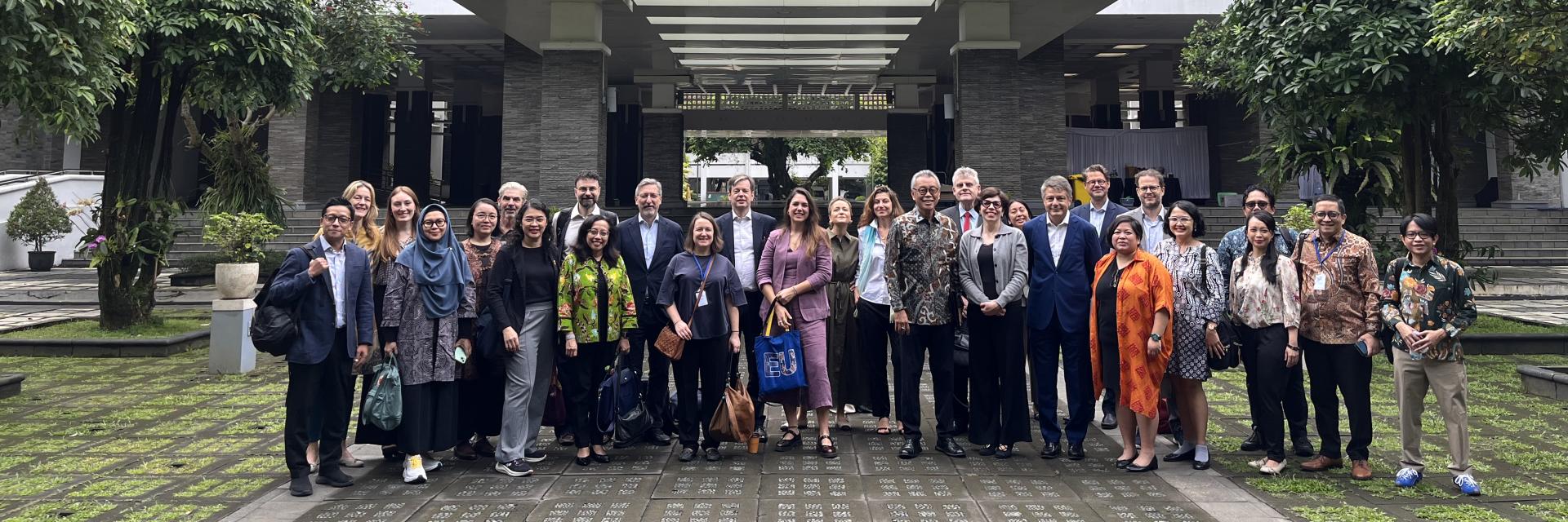 Group picture in front of a building of the Gadjah Mada University