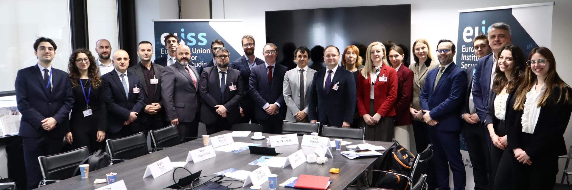Group posing for a photo in the EUISS meeting room. Credit photo: EUISS