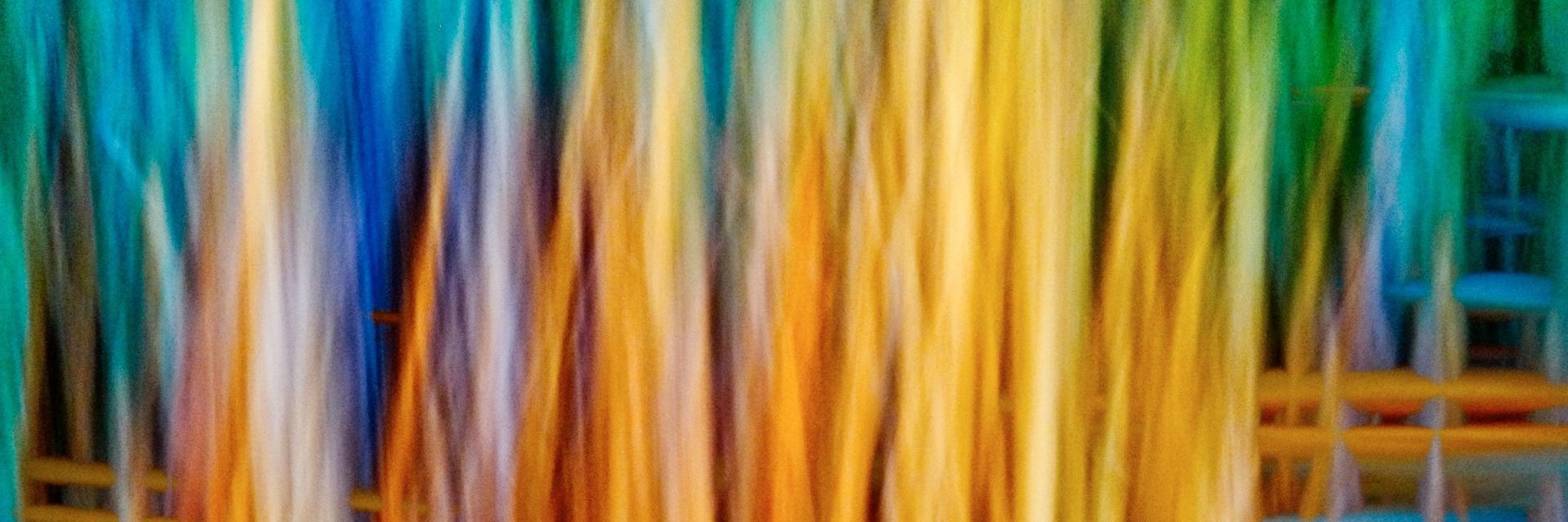 Digital abstract art of yellow and blue weaved flowing lines. Image credit to Robert Clark on Unsplash.