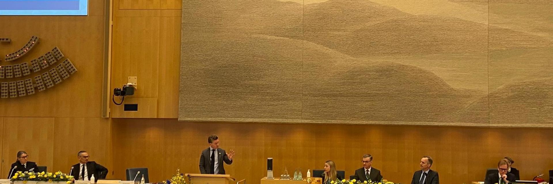 Speakers to the conference seated on podium © Sveriges Riksdag 