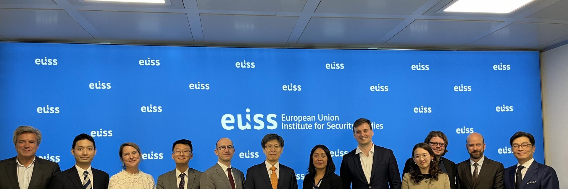 Image of event participants stood together for a photo © EUISS