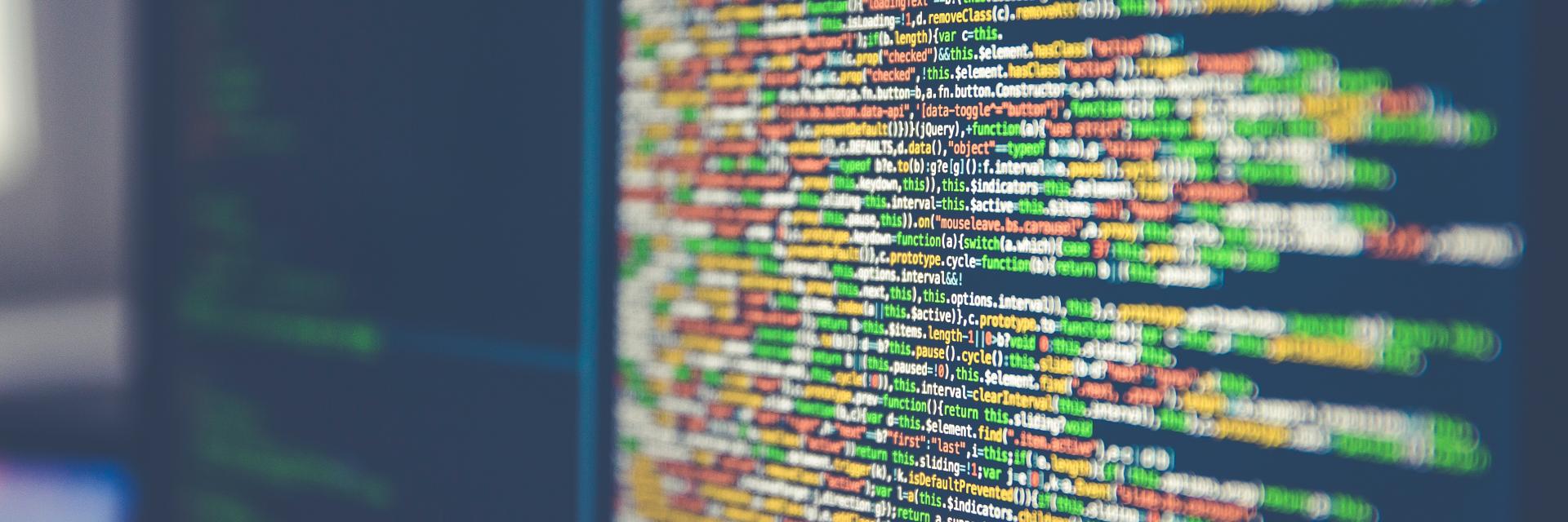 Code on monitor © Unsplash