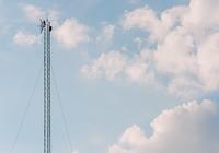 Antenna on blue sky background - Photo by Nima Mot on Unsplash