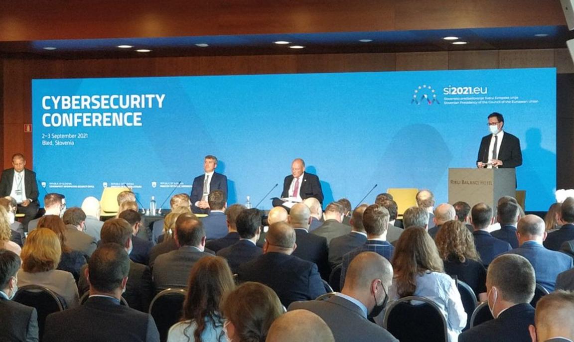 Persons on stage at conference