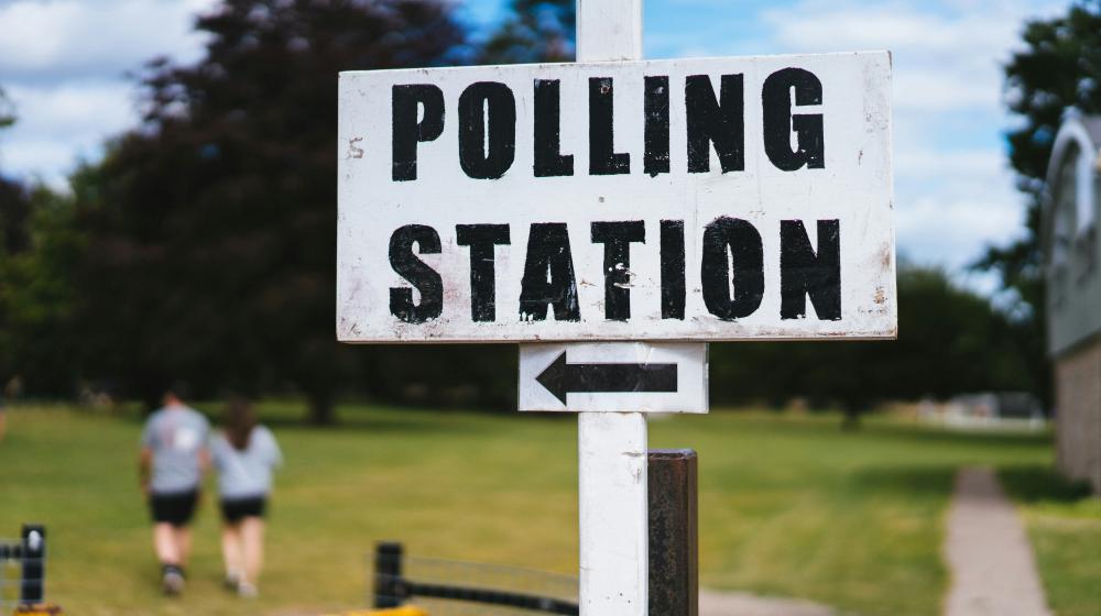 A polling station sign/Unsplash