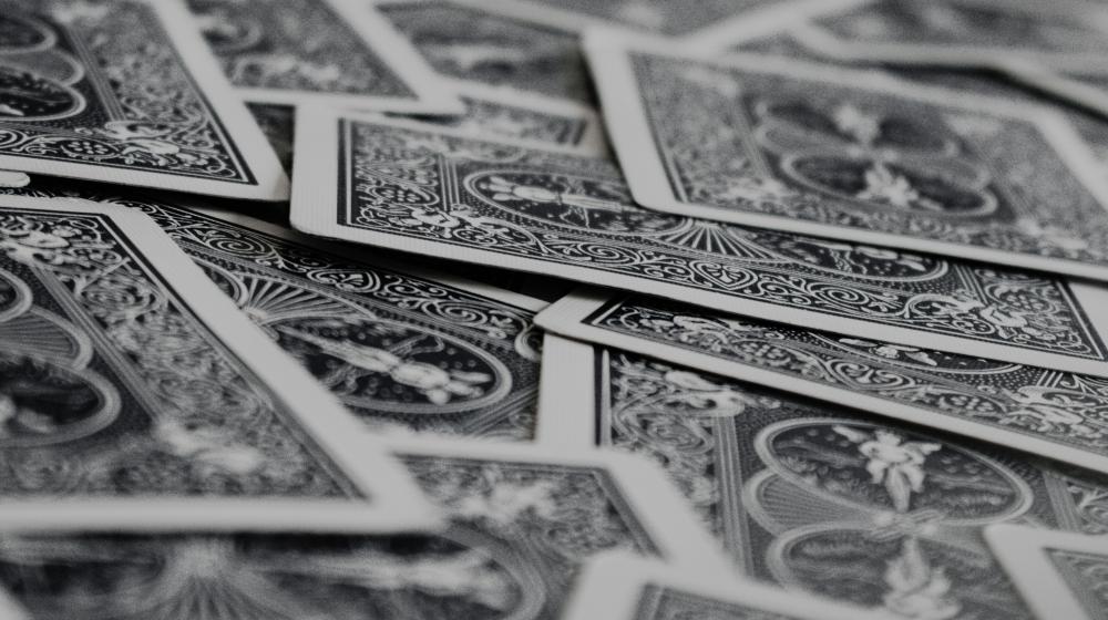 photo of playing cards, credit: Klim Musalimov/Unsplash