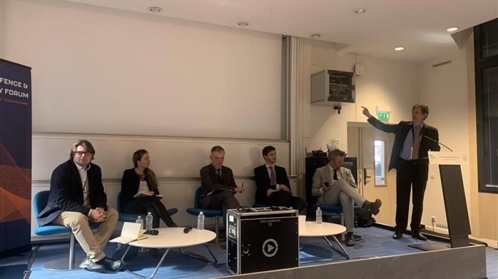Participants to panel sitting on stage