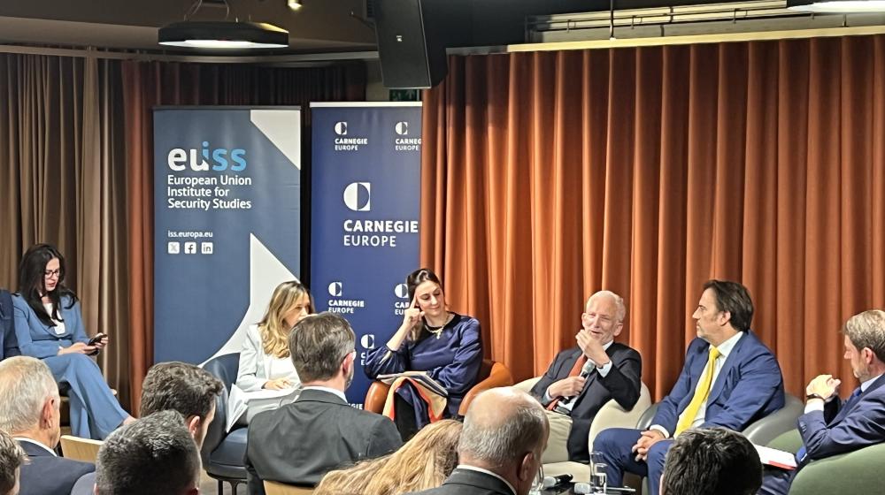 Speakers sitting on stage. Credit photo: Austrian Permanent Representation to the EU