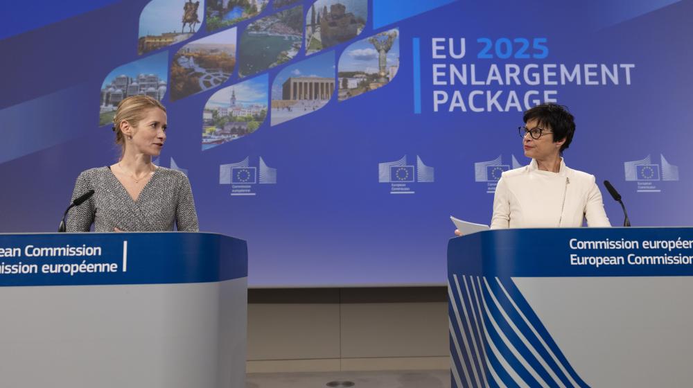 Kaja Kallas and Marta Kos on stage, in front of a screen announcing "EU 2025 enlargement package"Copyright: European Union, 2025