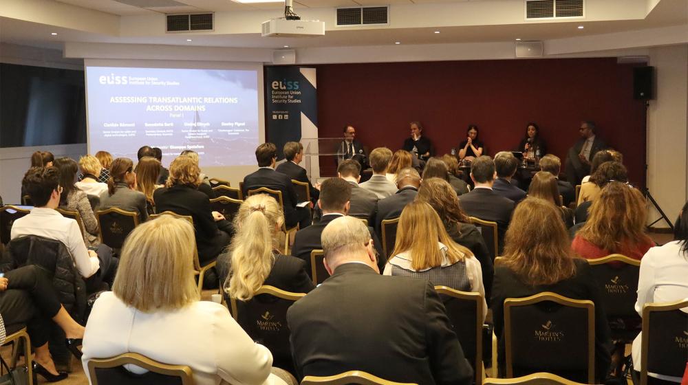 Room full of participants looking at stage where the speakers are sitting. Photo credit: EUISS 