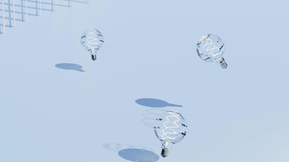 Light bulbs sitting on top of a snow covered ground. Photo by Anastasiia Ornarin on Unsplash: