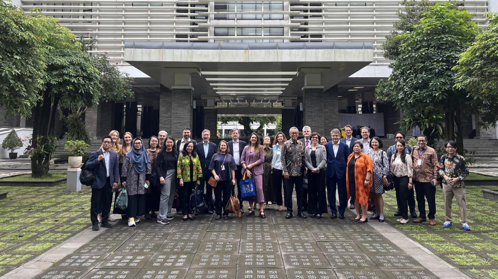 Group picture in front of a building of the Gadjah Mada University