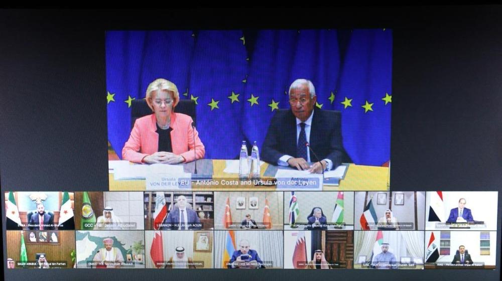 Video conference screen showing Ursula von der Leyen and Antonio Costa sitting at a table in front of EU flag, and multiple smaller windows below displaying participants from various Middle Eastern countries joining remotely