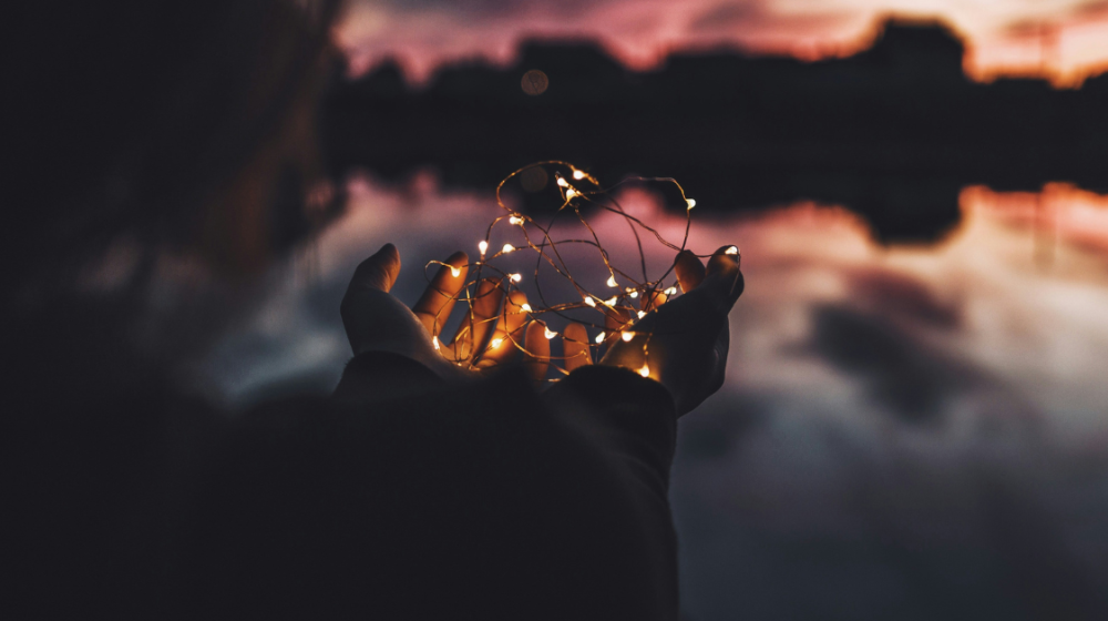  Person holding turned on string lights during nighttime Photo by Natalya Letunova on Unsplash