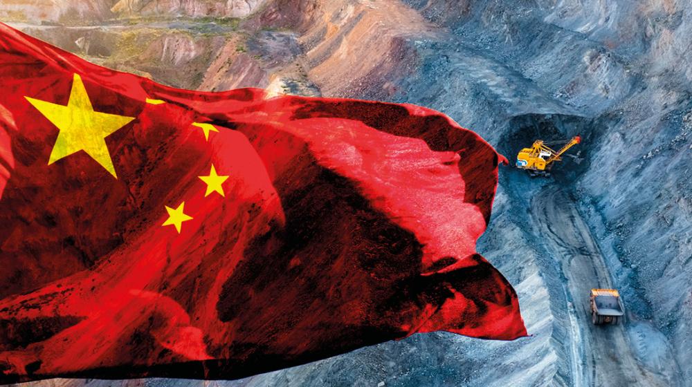 Chinese flag floating over open air mine