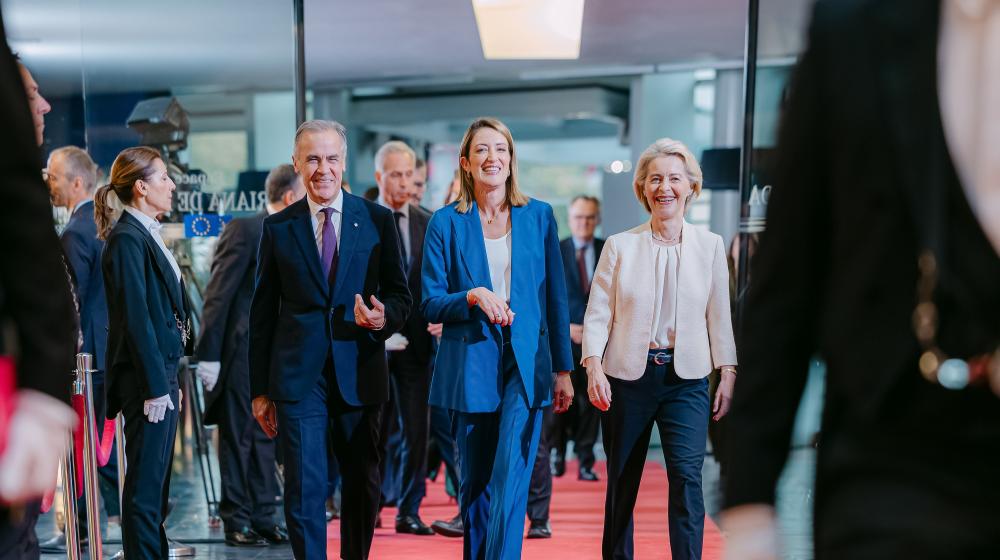 Mark Carney walking next to Roberta Metsola and Ursula von der Leyen. European Union, 2026.