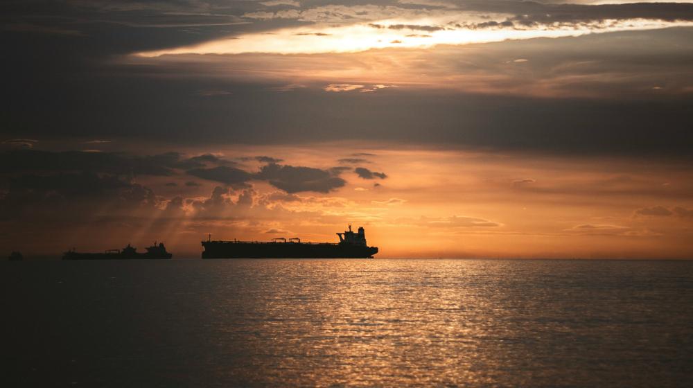 A ship sails into the sunset. Photo by alejandro luna on Unsplash
