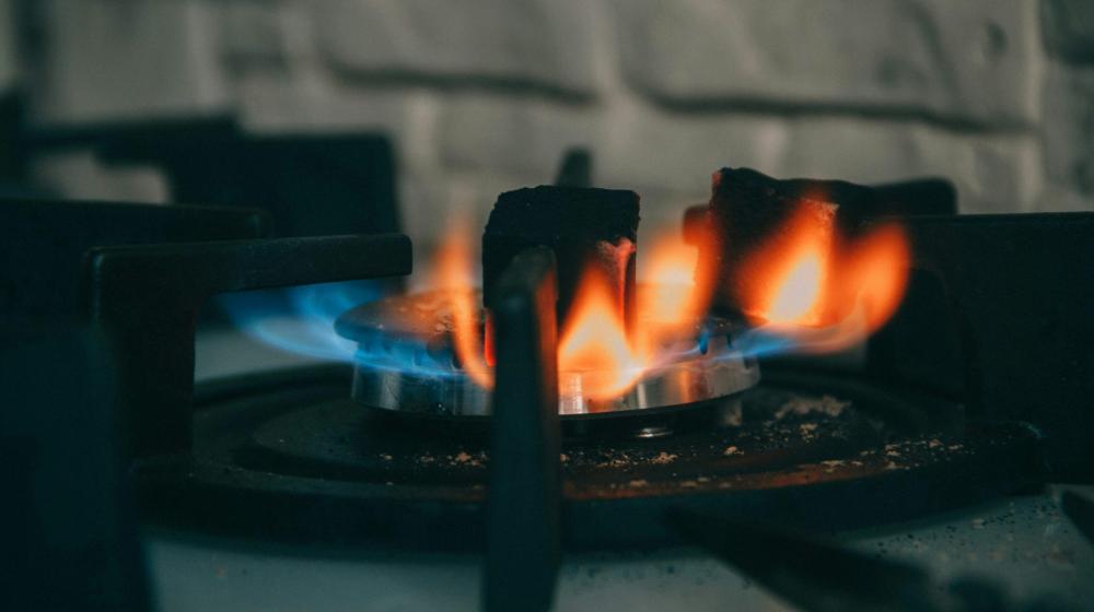 Close-up image of flame on a gas stove. Image credit to Alex Gagareen on Unsplash.