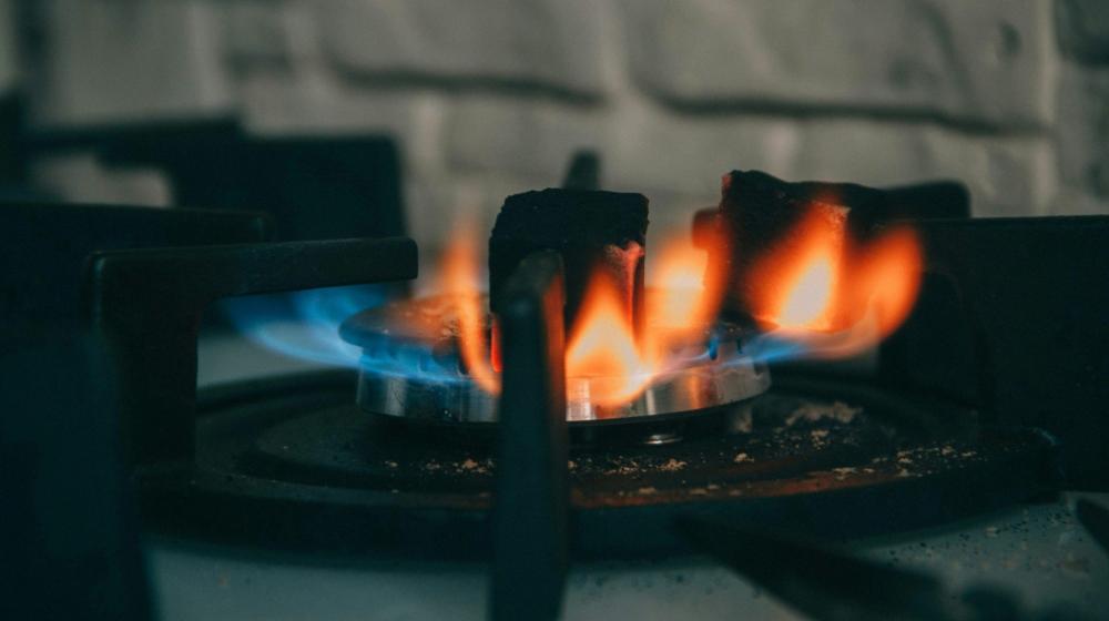 Close-up image of flame on a gas stove. Image credit to Alex Gagareen on Unsplash.