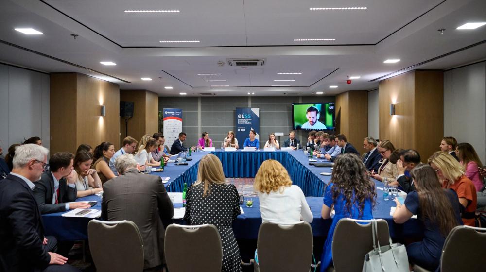 Participants to the event sitting around a table ©GLOBSEC