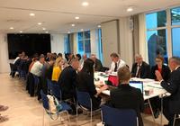 Table and participants at space event 