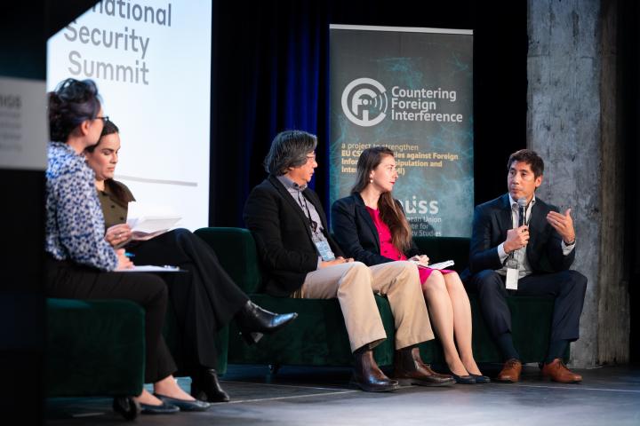 Speakers on stage at Montreal International Security Summit. Credit photo: JULIAN HABER-MIGS