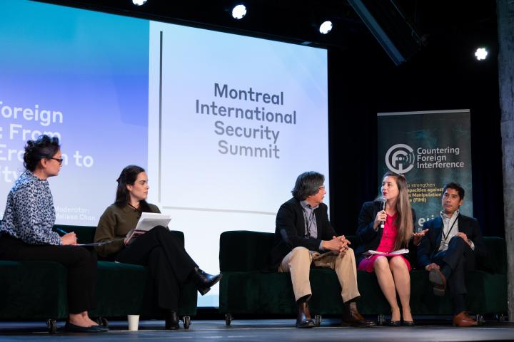 Speakers on stage at Montreal International Security Summit. Credit photo: JULIAN HABER-MIGS