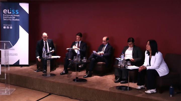 Speakers sitting on stage. Credit photo: EUISS